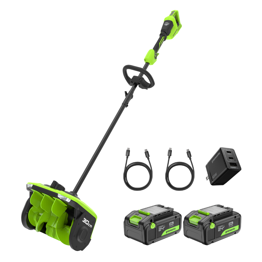 Green and black cordless snow blower set with batteries and charger on a white background